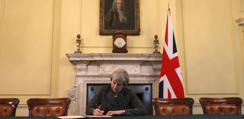 LONDON, ENGLAND - MARCH 28: British Prime Minister Theresa May in the cabinet, sitting below a painting of Britain's first Prime Minister Robert Walpole, signs the official letter to European Council President Donald Tusk invoking Article 50 and the United Kingdom's intention to leave the EU on March 28, 2017 in London, England. After holding a referendum in June 2016 the United Kingdom voted to leave the European Union, the signing of Article 50 now officially triggers that process. (Photo by Christopher Furlong - WPA Pool/Getty Images) LONDON, ENGLAND - MARCH 28: British Prime Minister Theresa May in the cabinet, sitting below a painting of Britain's first Prime Minister Robert Walpole, signs the official letter to European Council President Donald Tusk invoking Article 50 and the United Kingdom's intention to leave the EU on March 28, 2017 in London, England. After holding a referendum in June 2016 the United Kingdom voted to leave the European Union, the signing of Article 50 now officially triggers that process. (Photo by Christopher Furlong - WPA Pool/Getty Images)